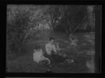 [Kansas] Photograph of woman sitting between two female children