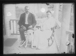 [Kansas] Photograph of man and woman sitting on rocking chairs