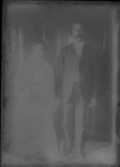 [Kansas] Photograph of older man wearing a tie and a suit with an older woman wearing a dress