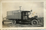 [Brownsville] Photograph of Porfiria Klahn sitting on Klahn's transfer truck