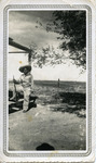 [People] Photograph of Roland Wieland holding a gun, wearing a hat