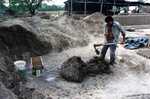 [Reynosa, CAV-Arriaga] Photograph of Brick Molder Mixing Clay Batch by Scott Cook