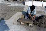 [Reynosa, CAV-Arriaga] Photograph of Brick Molder Trimming Excess Clay from a Mold by Scott Cook