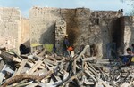 [Reynosa, CAV-Arriaga] Photograph of Jose Luis Martinez Tending a Kiln Firebox After Firing by Scott Cook