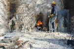 [Reynosa, CAV-Arriaga] Photograph of Jose Luis Martinez as Kiln Tender, Close-up View by Scott Cook