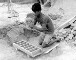[Reynosa, CEB] Photograph of Hilario Salazar Placing Clay into a Brick Mold by Scott Cook