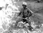[Reynosa, CEB] Photograph of Matias Rivera Mixing Clay for Brick Molding by Scott Cook