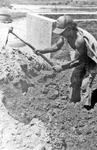 [Reynosa, CAV-Arriaga] Photograph of Tano Arriaga Hoeing Clay Before Wetting by Scott Cook