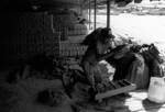 [Reynosa, CRG] Photograph of a Worker Tossing Wet Clay into a Brick Mold by Scott Cook