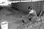 [Reynosa, CRG] Photograph of a Worker Scraping Excess Clay from a Mold by Scott Cook