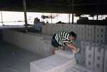 [Reynosa, CRG] Photograph of Workers Stacking Fully Dried Green Bricks on Pallets by Scott Cook