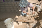 [Reynosa, ELL-New] Photograph of Manuel Pasilla Scraping Excess Clay from a Mold by Scott Cook