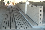 [Reynosa, ELL-New] Photograph of Pedro Escamilla Transporting a Filled Brick Mold by Scott Cook