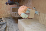 [Reynosa, ELL-New] Photograph of Kiln Setters Loading a Kiln for Firing by Scott Cook