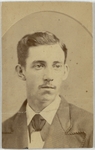 Young man with hair combed back, thin mustache, corduroy tuxedo and a tie, looking towards the right, front by William A. Williams