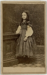 Young girl with ringlets wearing a necklace, front