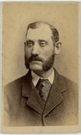 Portrait of a man with mutton chops, half length, facing left, front