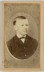 Young man in dark suit and bow tie, half length, facing right, front