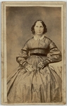 Woman in silk dress with collar brooch, front