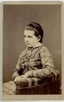 Girl in checkered dress, three quarter length, facing left, front