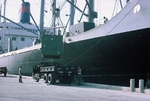 Photograph of Cam-Rahn Bay, ship unloading onto a U.S. Army truck by Cayetano E. Barrera