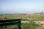 Photograph of perimeter barbed wire fences and bunkers at Cu-Chi by Cayetano E. Barrera