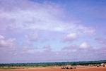 Photograph of an air strip and fuel bladders by Cayetano E. Barrera