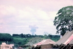 Photograph of air strike at Quan-Loi, airplane barely visible by Cayetano E. Barrera