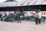 Photograph of Army of the Republic of Vietnam (ARVN) soldiers pitching coins by Cayetano E. Barrera