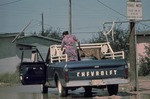 Woman filling up tanks on truck with potable water
