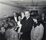 Lyndon B. Johnson being sworn in aboard Air Force One by Federal Judge Sarah T. Hughes, following the assassination of John F. Kennedy