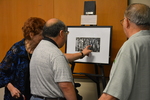 Former Rio Grande Valley athletes examining an exhibit (6)