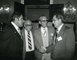 Photograph of Kika de la Garza with Julius Collins, Guy Pete, and Congressman J. J. Pickle at shrimper's meeting
