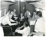 Photograph of dignitaries on a private jet en route to Washington D.C from Mission, Texas