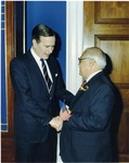 Photograph of Kika de la Garza with President George H. W. Bush