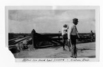 [Brownsville] Photograph of two men on top of the Brownsville and Matamoros International Bridge