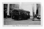 [Brownsville] Photograph of the Brownsville Street & Interurban Railroad electric trolley train on the intersection of 11th st. and Washington st.