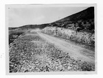 [Roads] Photograph of road easement under construction through mountains - 04