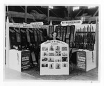 [Expositions] Photograph of Watty Watkins Sporting Goods booth at exposition featuring fishing at 8th Pass photographs