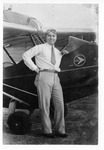 [Airport] Photograph of pilot beside Curtiss-Wright Junior aircraft