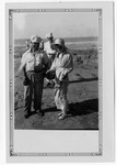 [People] Photograph of beachcombers discovering artifacts