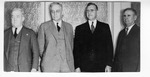 [People] Photograph of four unidentified men in suits