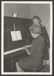[Harlingen] [Annie Rooney Hill at Piano]