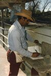 [Los Ebanos] Photograph of Man Writing on Journal