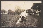 [Harlingen] Photograph of Lon C. Hill and His Dog in a Field