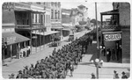Photograph of soldiers marching to Fort Brown