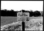 Photograph of a 100 Year Flood Level sign