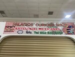 Photograph of Palacios' Curious Shop Sign by Sara E. Azua and Viviana Veronica Garza