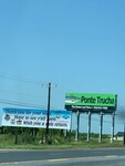 Photograph of "Ponte Trucha - The Green Law Firm" Billboard by Sara E. Azua and Laura Lamb