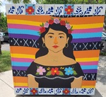 Photograph of Mujer wearing "Puro 956" Necklace Mural by Sara E. Azua and Zoraya Berlanga